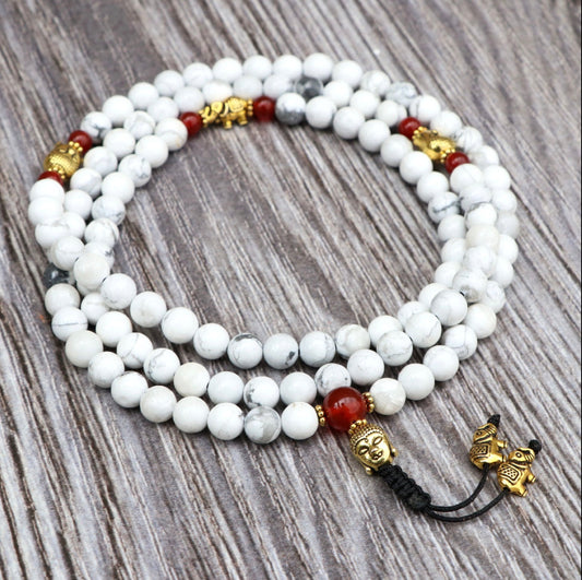 Collar Mala de Howlita Espiritual con Cabeza de Buda y Elefante – Calma y Sabiduría - Buddha Stones